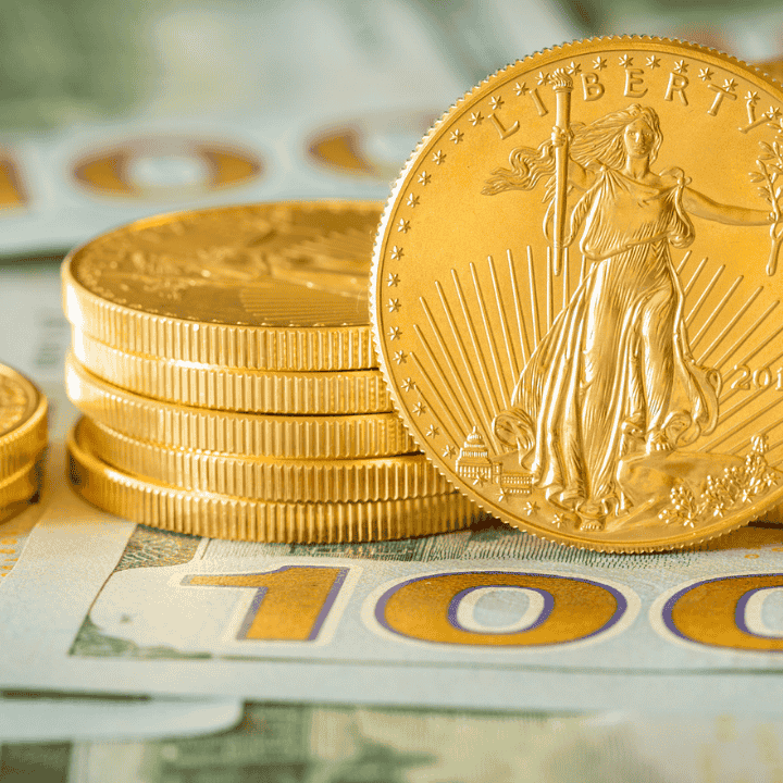 gold coins on top of money